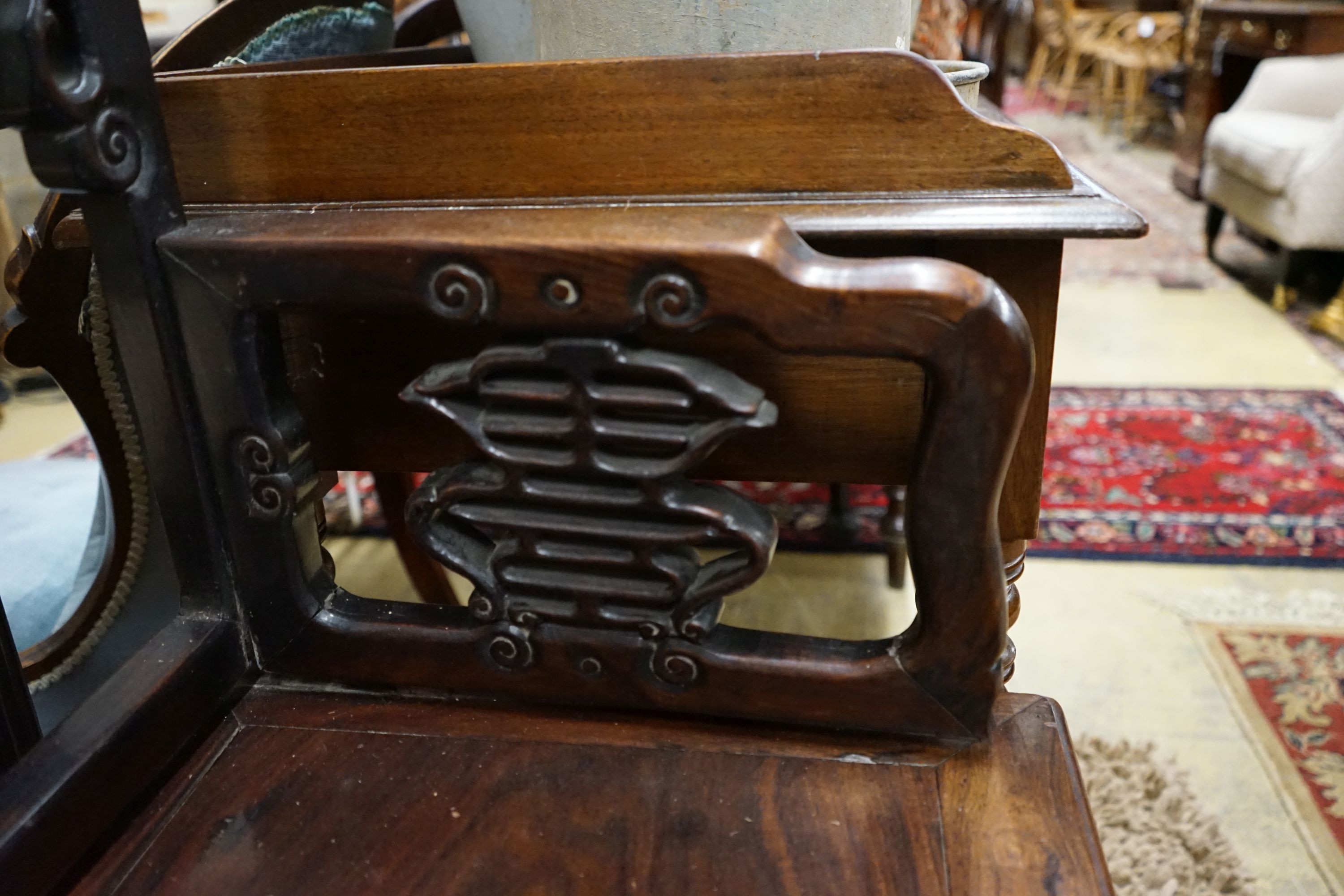 A pair of Chinese carved hongmu elbow chairs (a.f.), width 65cm, depth 48cm, height 96cm
